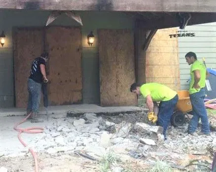 Crew breaking out concrete during a demolition job in Houston, TX